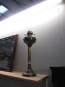 A Palladium column oil lamp with glass funnel