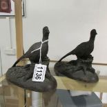 A pair of bronze effect resin pheasants.