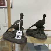 A pair of bronze effect resin pheasants.