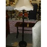 A lacquered standard lamp.