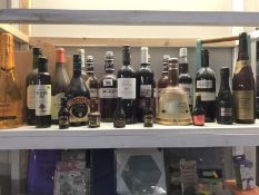 A shelf of alcohol, including wine etc.
