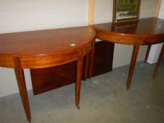 A pair of Georgian mahogany 'D' end dining tables with leaf.