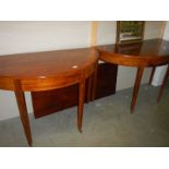 A pair of Georgian mahogany 'D' end dining tables with leaf.