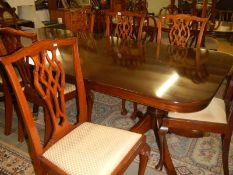 A mahogany extending dining table & 6 chairs & 2 other chairs (not matching)