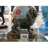A 19th century metal figure of a lion.