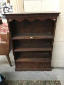 A bookcase with 1 drawer