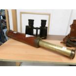 A G Davis of Leeds brass and leather telescope together with a pair of brass prism binoculars.