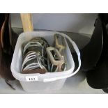 A bucket of 17 odd stirrups and 4 old spurs (steam punk interest)