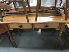 A 2 drawer solid pine desk