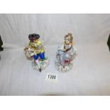 A pair of continental porcelain figures.