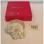 A Butler & Wilson cultured pearl bracelet in original box.