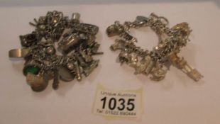 2 white metal charm bracelets with charms including some hall marked silver.