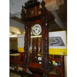 A mahogany wall clock.