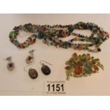 A mulitgem necklace including amethyst, rainbow moonstone, citrine etc.