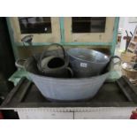 A galvanised wash tub,