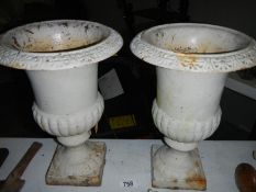 2 cast iron urns