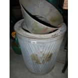 A vintage galvanized washtub and one other