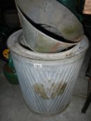 A vintage galvanized washtub and one other