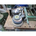 A bench grinder and wheels with maxi clamp