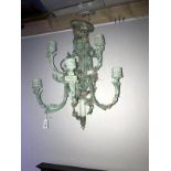 A metal 5 branch wall mounted floral light décor