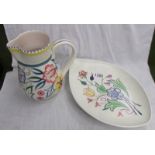 A Poole pottery jug and plate.