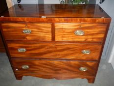A Victorian mahogany chest of drawers with cross banded inlay to top