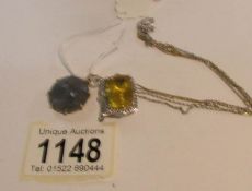 A golden floride with 4 small diamonds pendant set in silver with neck chain and a labradorite