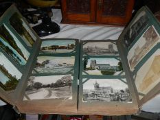 An Edwardian cabinet album of approximately 400 postcards including Lincolnshire, York, London,