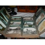 An Edwardian cabinet album of approximately 400 postcards including Lincolnshire, York, London,