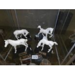 4 Beswick white horses.