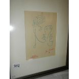 A Jean Cocteau (1889-1963) modernist print of 2 faces, stamped and signed in coloured pencil.