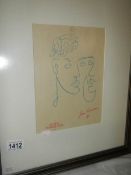 A Jean Cocteau (1889-1963) modernist print of 2 faces, stamped and signed in coloured pencil.