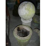A stone ball on a column base and one other