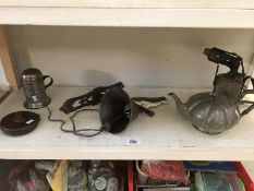 A cast iron wall dog bell, pewter teapot, blow lamp etc.