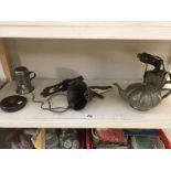 A cast iron wall dog bell, pewter teapot, blow lamp etc.