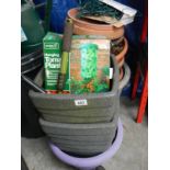 A large quantity of plastic plant pots etc.