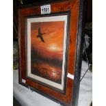 A John Trickett (B.1953) oil on canvas of mallard duck in flight at sunset, signed.