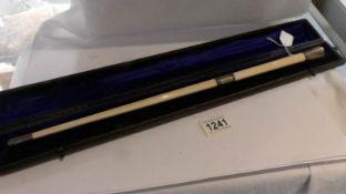A cased presentation choir masters baton with silver mounts, dated 1905.