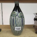 A Moorcroft 'Peacock Parade' first quality vase.