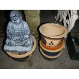 5 decorative plant pots and a Buddha