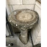 A stone bird bath