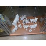 8 bisque porcelain dog figures.