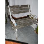 A cast aluminium and wood slat seat