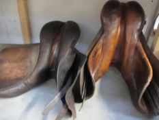 2 old saddles