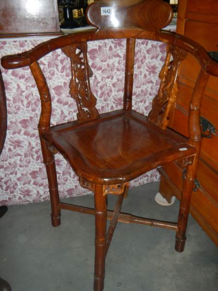 A mahogany corner chair.