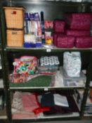 3 shelves of sewing related items and a good lot of fabric