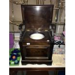 A vintage commode with china insert