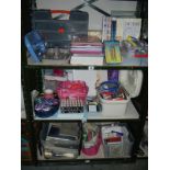 3 shelves of craft work items including ribbons and paper