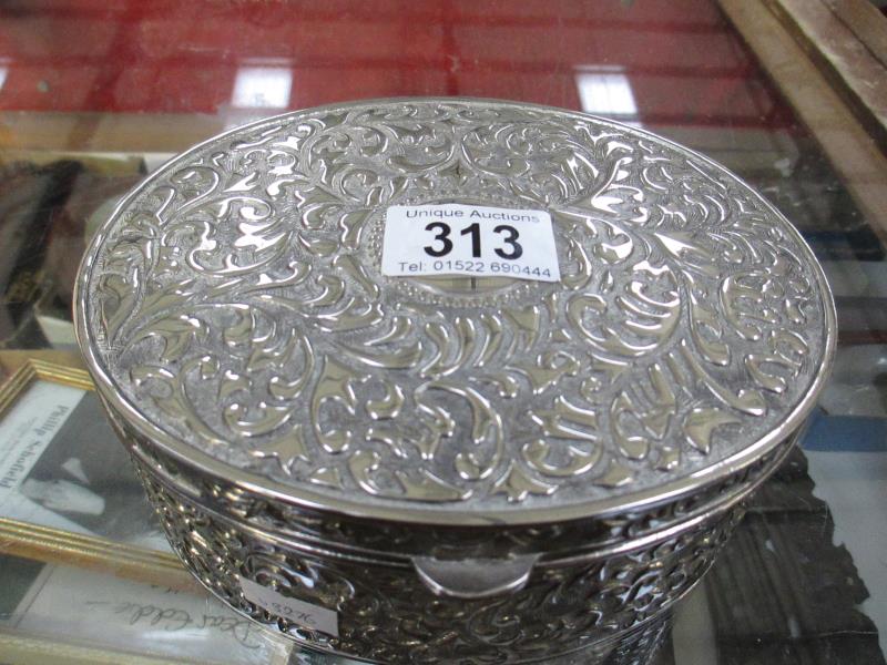 A silver plate jewellery box containing costume jewellery etc.