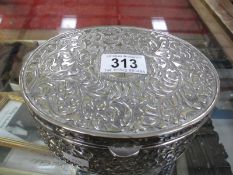 A silver plate jewellery box containing costume jewellery etc.